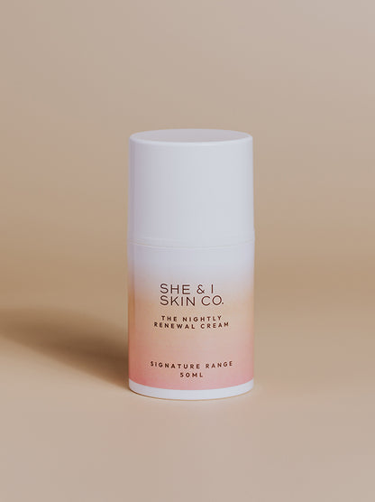 She & I Skin Co. "The Nightly Renewal Cream," 50ml, designed to rejuvenate skin overnight. Presented in sleek gradient white-to-pink packaging on a minimalist beige background.